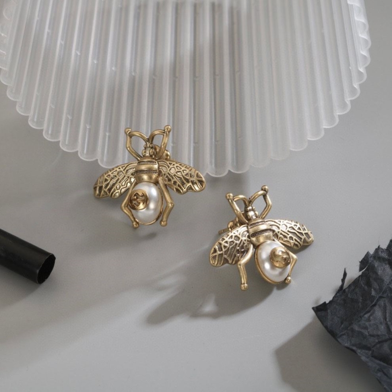 G*u*i earrings